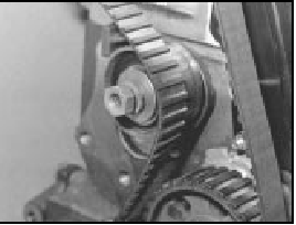 28.8 Slipping timing belt onto tensioner pulley