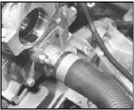 8A.6 The thermostat housing (shown with distributor removal) on the 999 cc