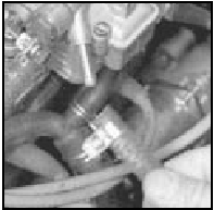 Fig. 1.15 Fuel return hose disconnected from carburettor (Sec 13)