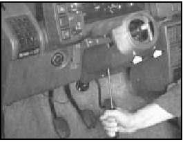 Fig. 10.2 Removing steering column shroud screws (Sec 5)