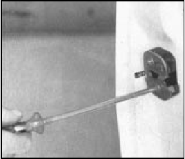 Fig. 12.14 Removing door lock fixing screw (Sec 12)