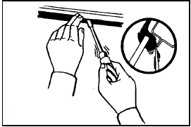 Fig. 12.16 Peeling back lip of windscreen glass weatherseal (Sec 15)