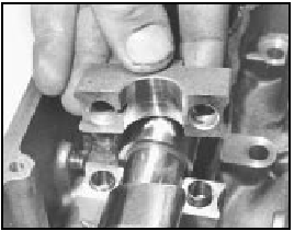5B.23D Camshaft bearing cap showing short and long positioning dowels for