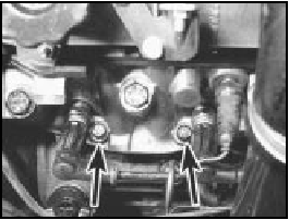 6B.13 Two of the four additional cylinder head bolts (arrowed)