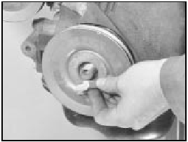 7B.34 Crankshaft pulley nut removal