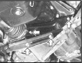 Fig. 13.19 Unscrew the bolts at the points indicated to release the gear