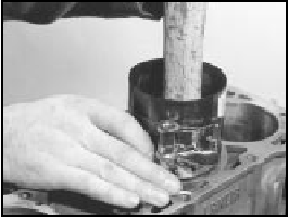 7B.194B Tapping a piston into its bore