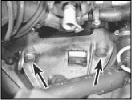 12B.36 Transmission upper retaining bolts. Note bracket under the left-hand