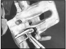 14B.36 Disconnecting the handbrake cable from the caliper lever